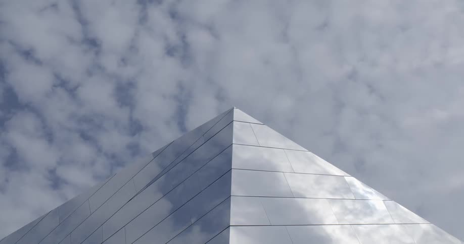 The clouds reflect on the pyramid