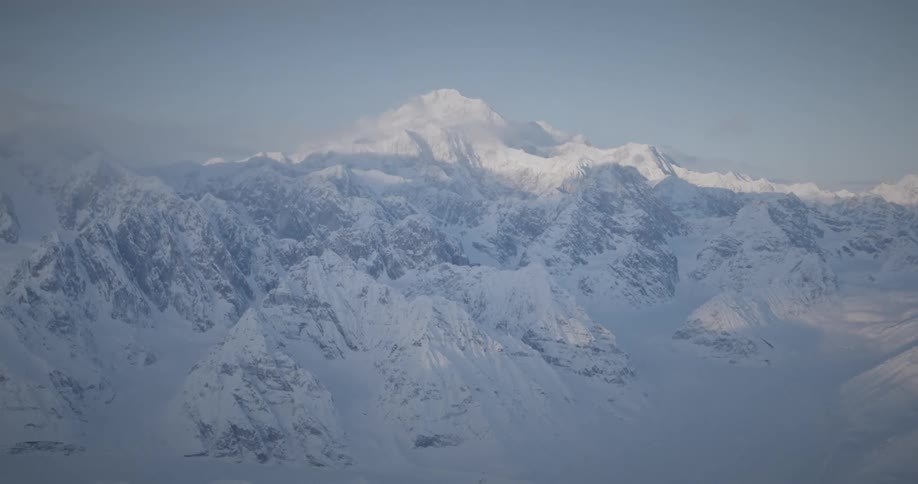 Aerial view of snow covered mountains at morning