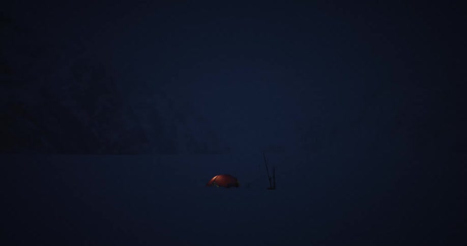 Panorama of a tent in the midst of a snowcovered plateau at night