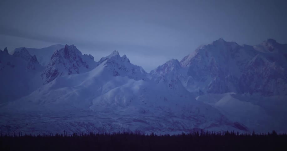 The mountain range is covered with snow