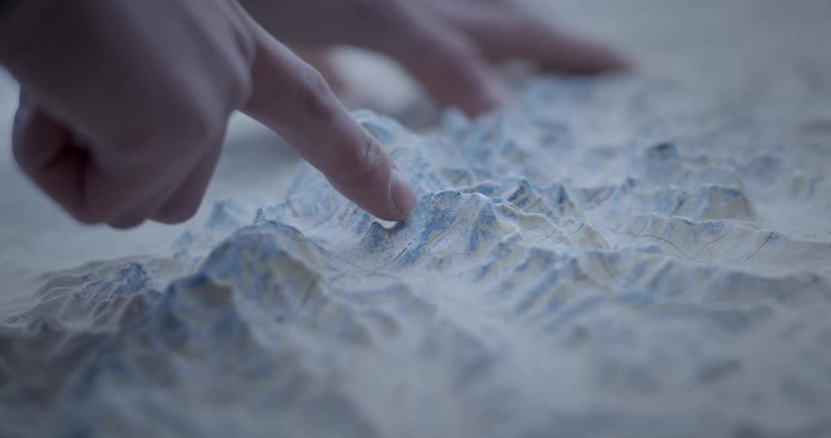 Fingers pointing to mockup mountain