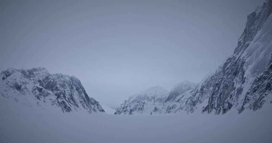 Snows in a mountain area at sunset