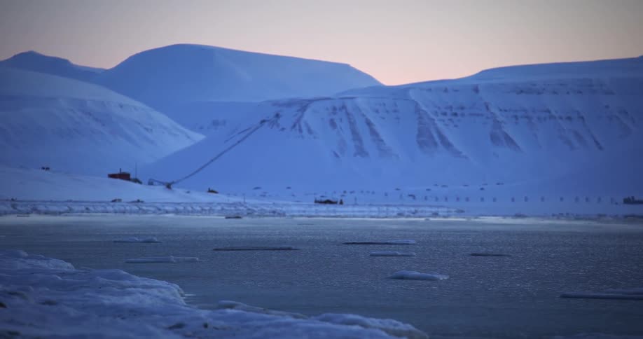 A region with a sea and a lot of ice around and on the surface of the water