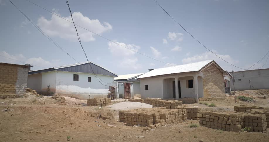 Bricks for a house under construction in a plot on the neighborhood