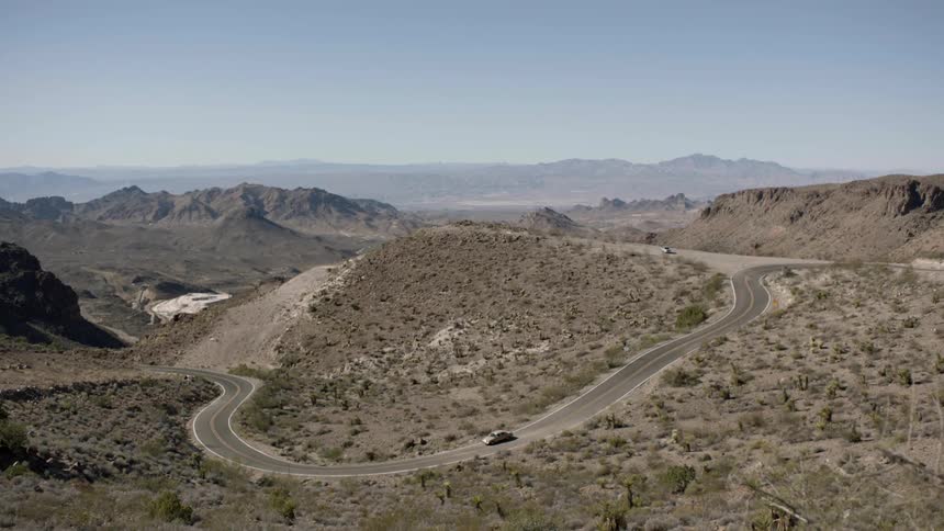 A road winds through the desert