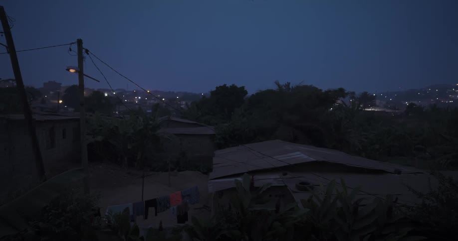Street lamp flickers in suburbs at night