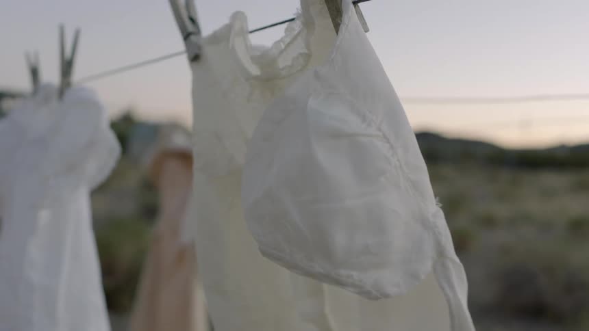Laundry dries on a clothesline on a breezy day