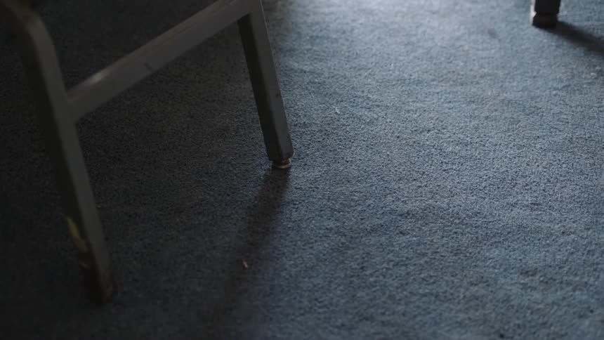 The sun is shining in on the carpet below