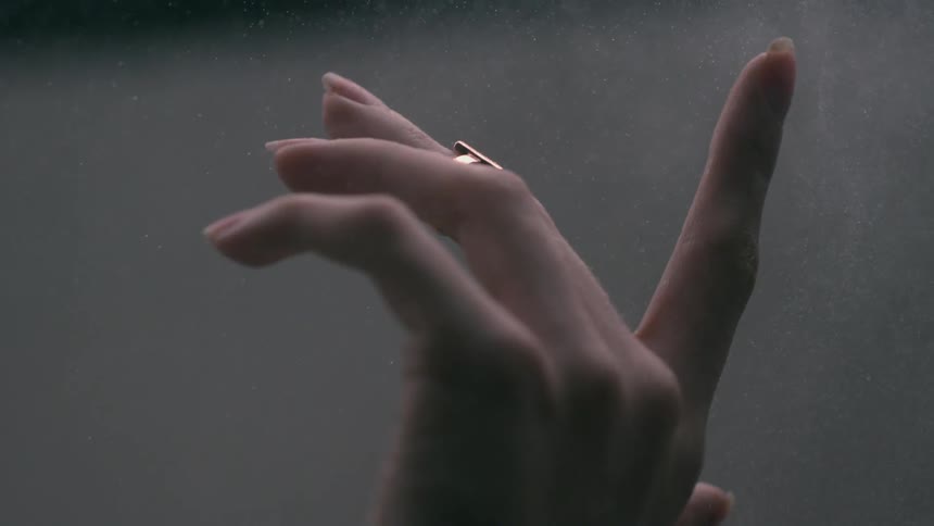 A person is moving their fingers in the air