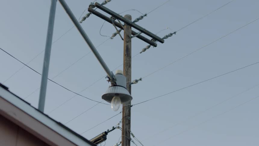 A power line stands overhead