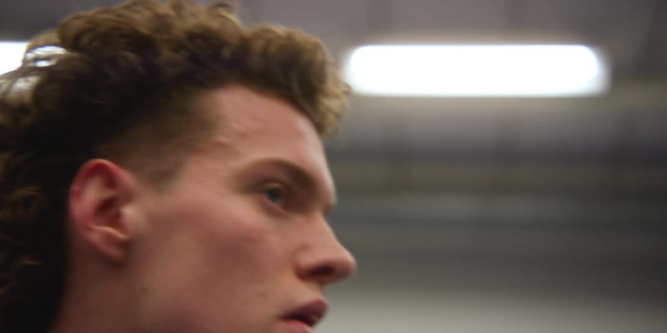 A man wiping sweat from his face