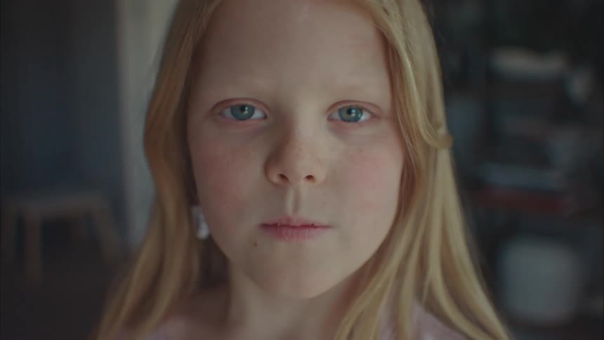 A child is staring and blinking
