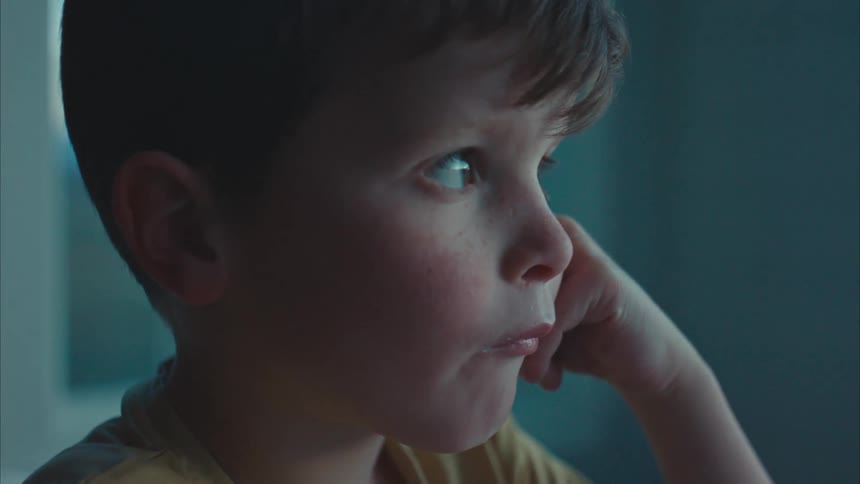 Portrait of a little boy eating cereal