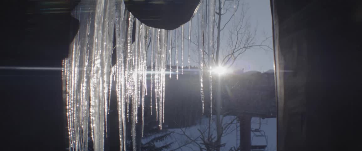 Long icicles drip from the structure