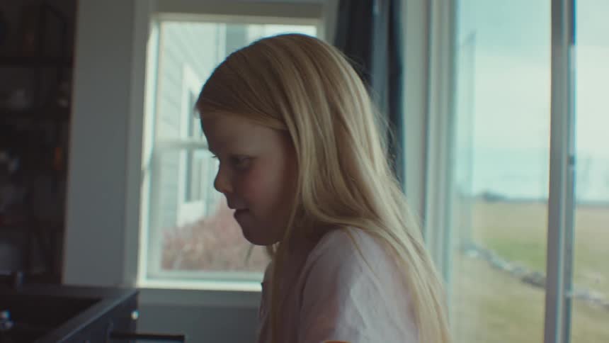 Little girl in a room playing at a games table