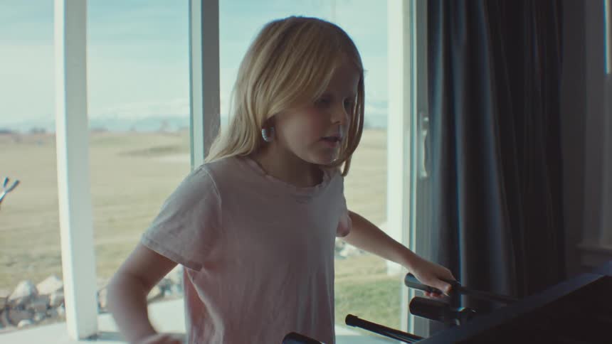 A young girl has fun playing foosball