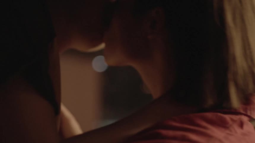 A couple of people kissing and making out