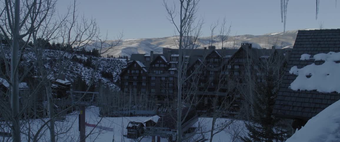 Panorama of a residential neighborhood amid snowy mountains