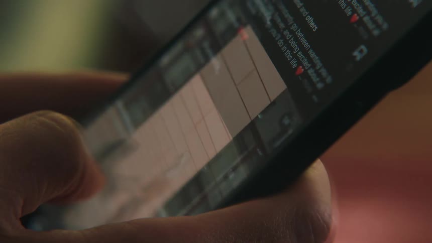 A person is scrolling through an app on their phone