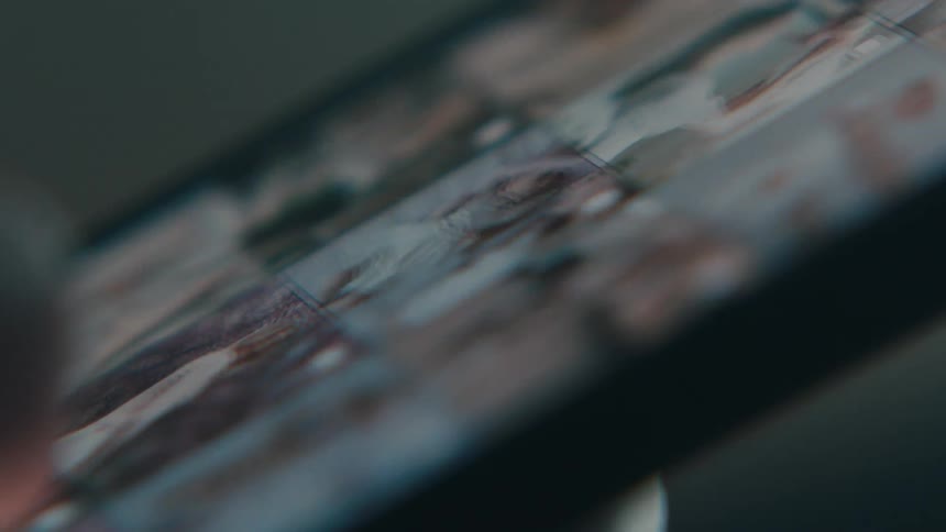 Person scrolls through photo gallery on smartphone