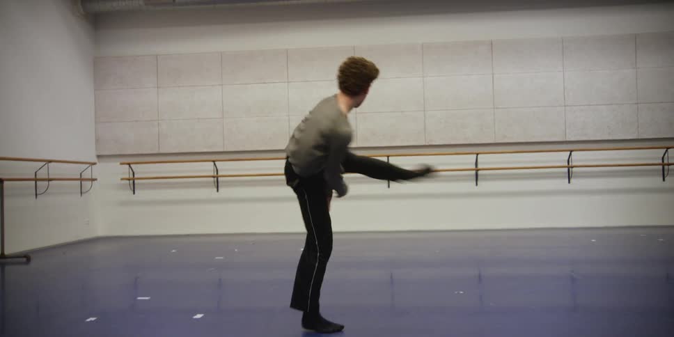 Young man in a room performing and training his dance