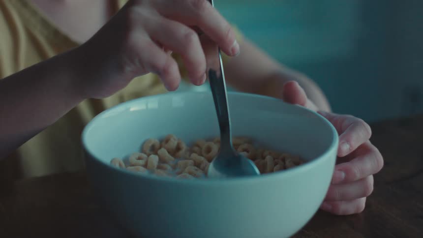 Portrait of a little boy eating cereal