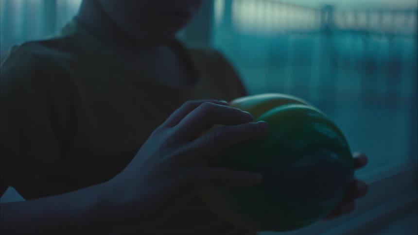 A young boy holds a football