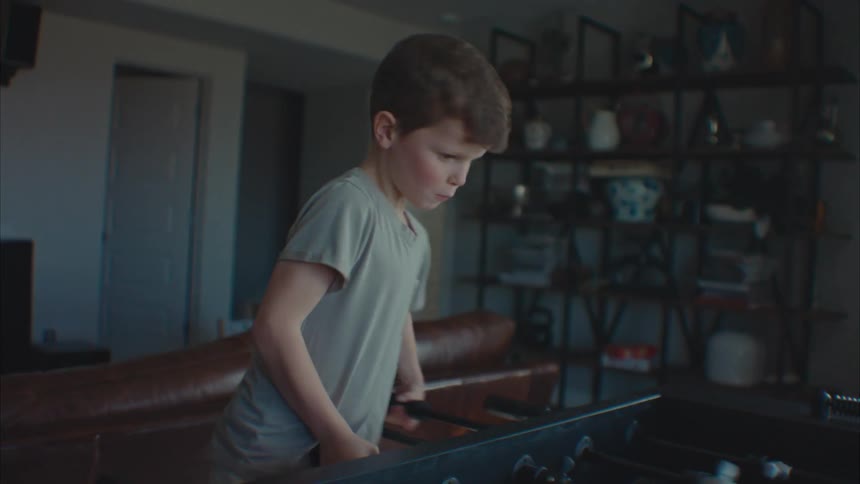 A clip of a boy playing table football