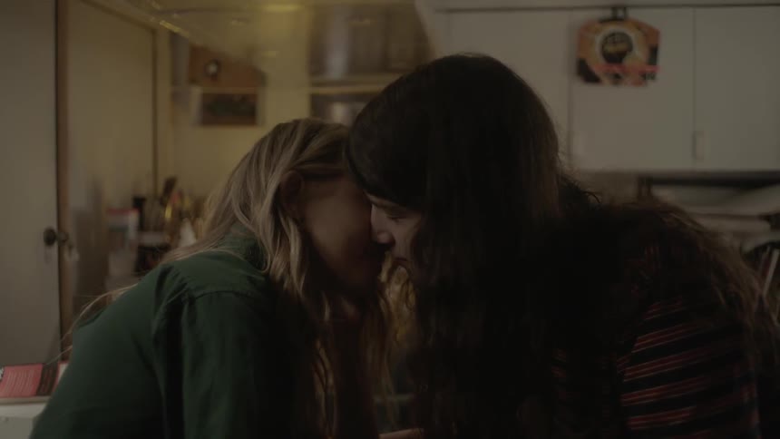 A man and woman kiss