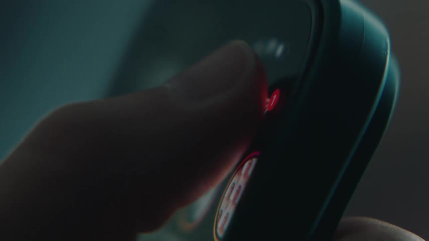 Hand of a person navigating a mobile application on a smartphone