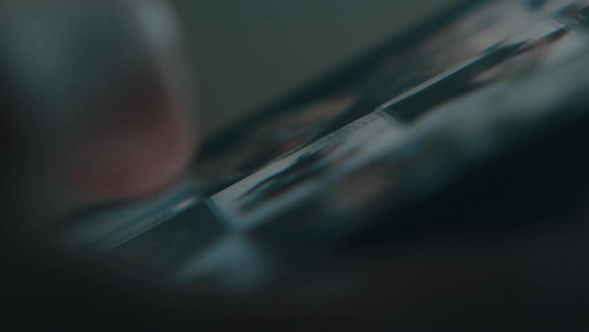 A thumb scrolling across a smartphone screen