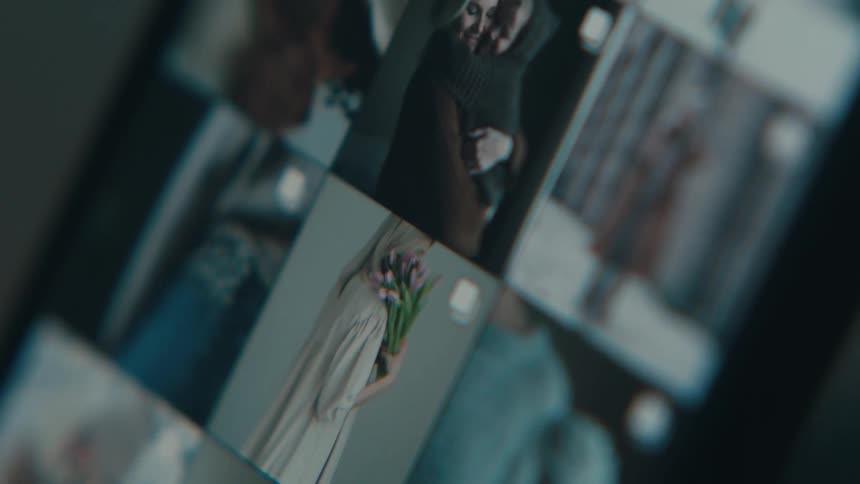 Extreme closeup on a cell phone screen with photos scrolling by