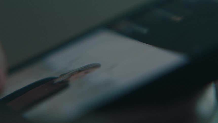 Close up of a finger scrolling through images on a smartphone