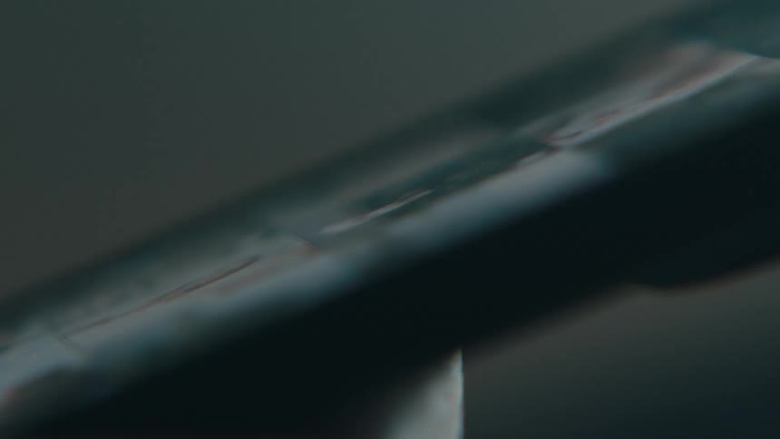A person scrolls through photos on a smartphone