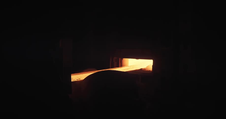 Solid iron emerging from glowing embers