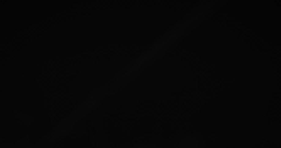 Lights are on the ceiling of the dark tunnel