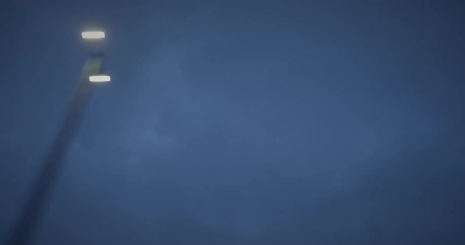 Heavy clouds are over the lamp posts