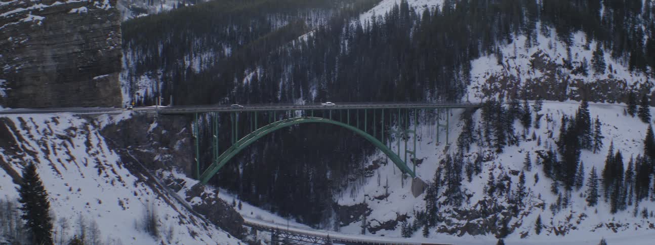 Cars cross the long bridge on the mountains