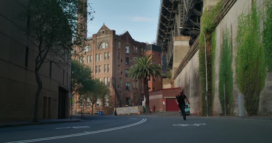 A man skates down a city street