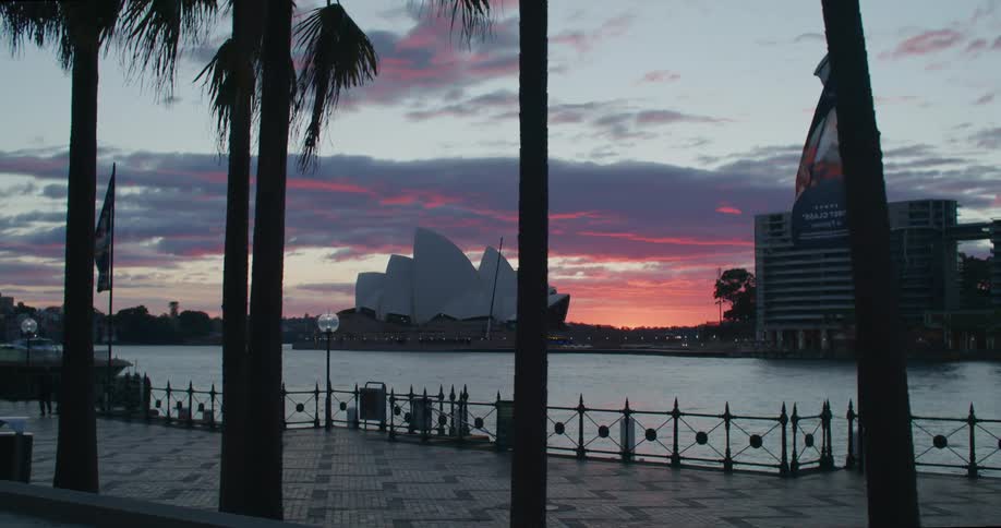 Landscape of a sydney tourist center on a morning with a red sky
