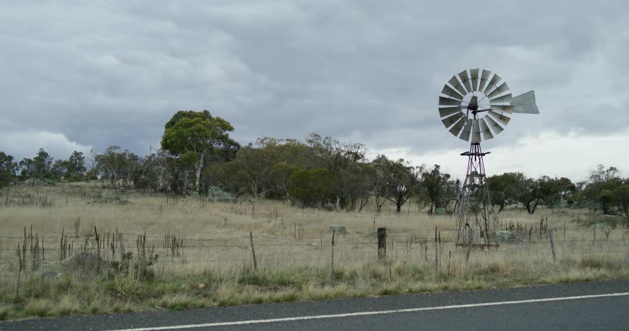 A clip of a grass field closer to the road