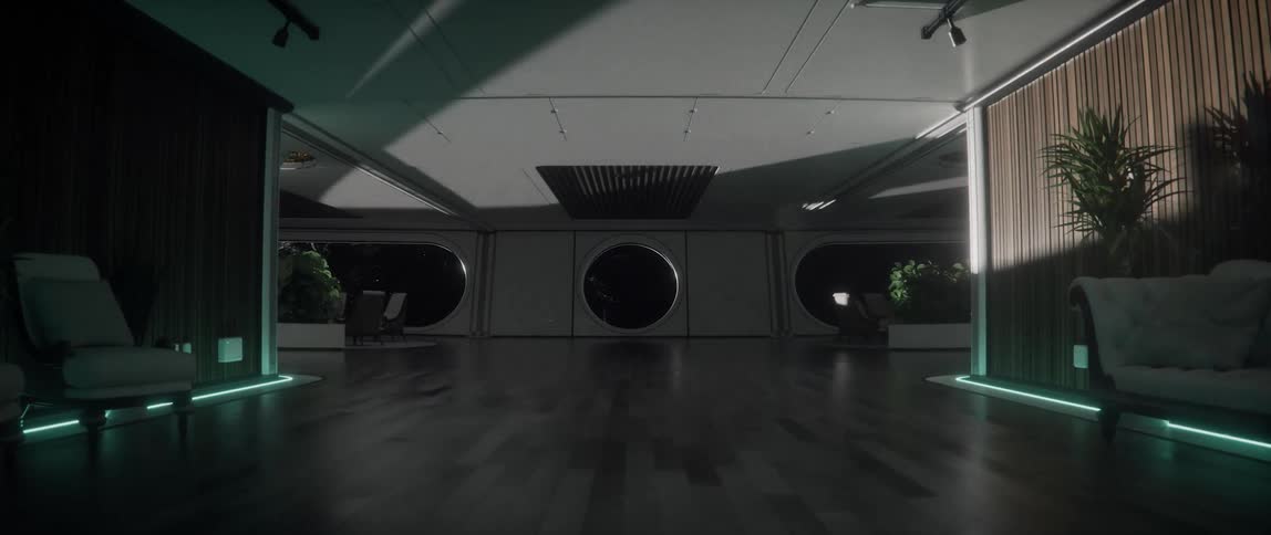 Light and shadows move across modern interior of a rotating space station