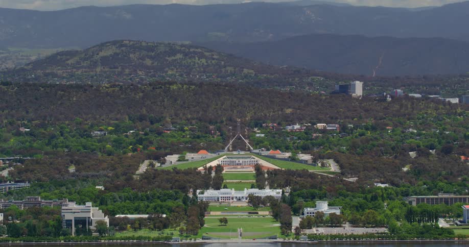 Panorama of a palace amidst hills with mountains around