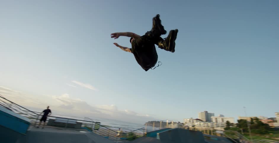 A skater executes a jump in a skate park