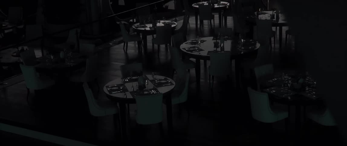 Tables and chairs in a restaurant on a rotating space station