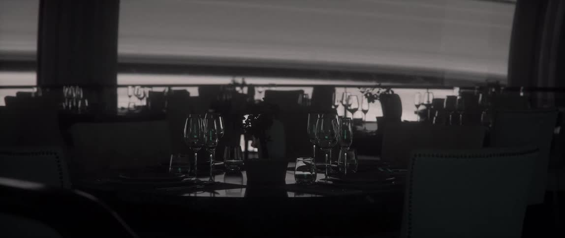 Dining tables beautifully adorned with glasses and plates in restaurant on a rotating space station