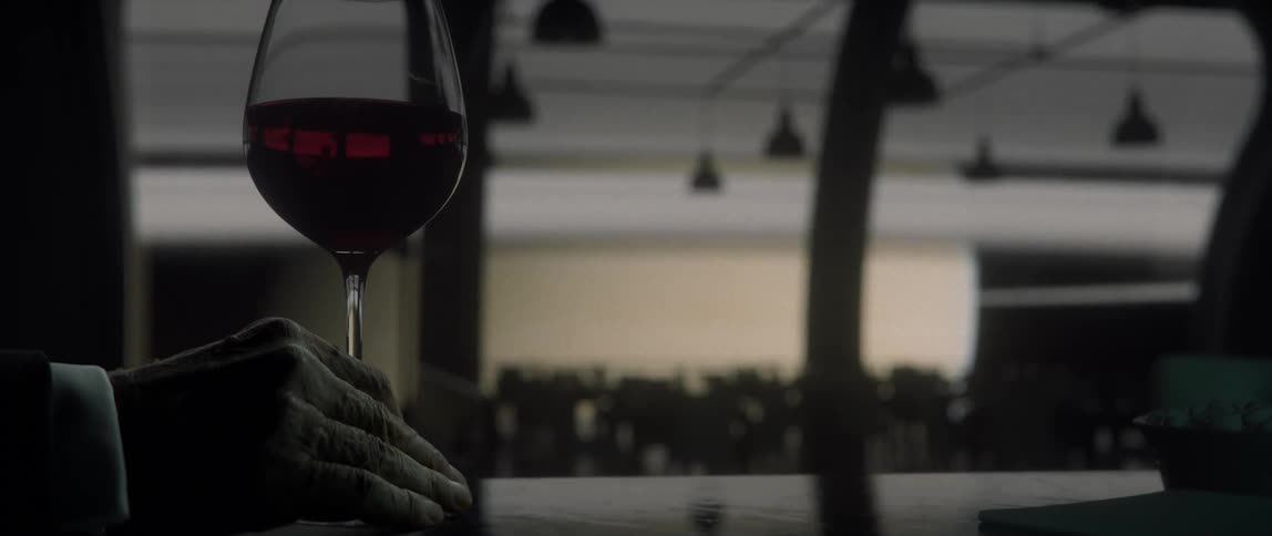 A person sits at a bar with a glass of wine on a rotating space station with planet Saturn outside