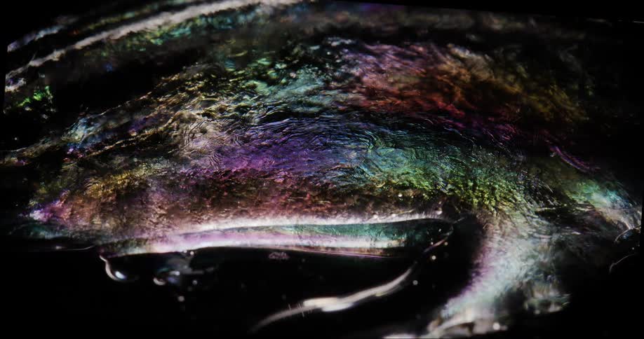 Abstract fluid with rainbow coloring in slow motion