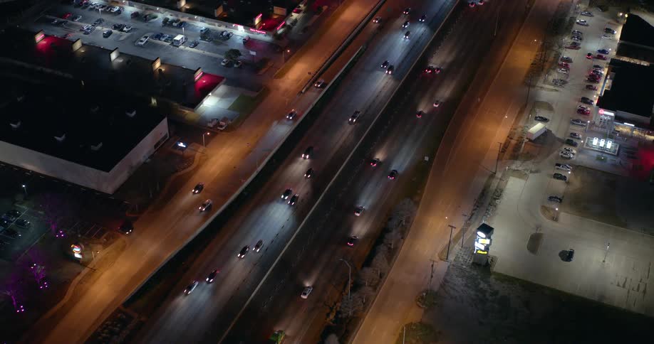 Traffic runs on the freeway at night