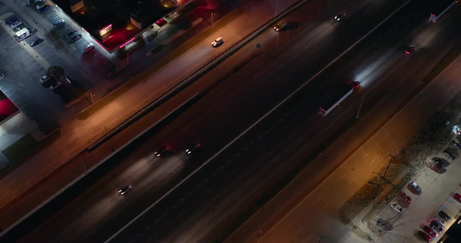 Aerial view 2 way street traffic at night